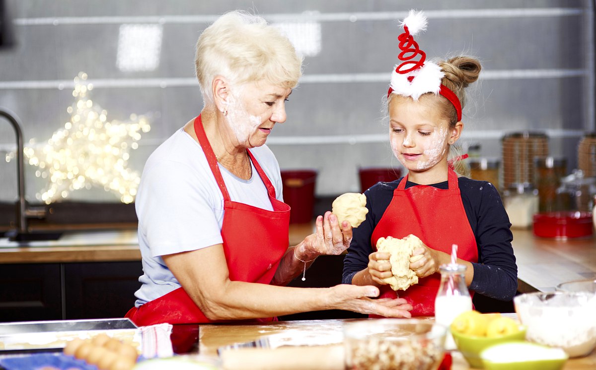 senior-with-girl-kneading-dough-kitchen.jpg